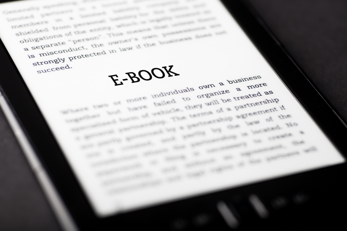 E-book on tablet touchpad, ebook concept